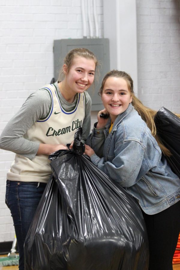 A+group+of+Amherst+students+collected+over+90+stuffed+animals+in+a+teddy+bear+toss+during+the+boys+Iola+vs+Amherst+basketball+game.+Haley+Peskie+and+Aleah+Breed+carried+them+off+to+be+distributed+to+local+emergency+services.