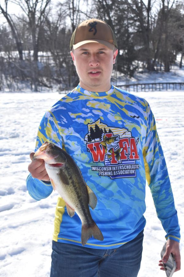 Jacob Gibby Gibbs boasts a bass caught on Lake Emily near Amherst to close out the ice fishing season. 