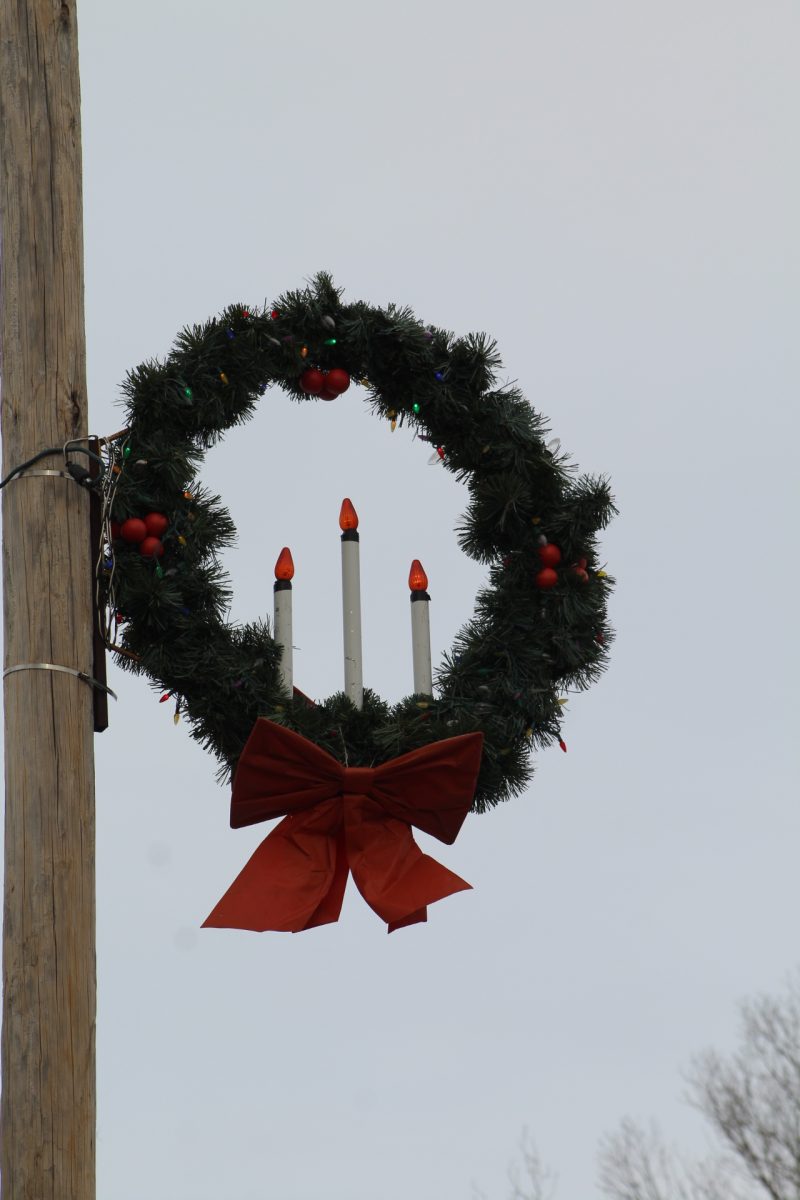 Festive decorations are seen on poles and signs in Amherst during December.