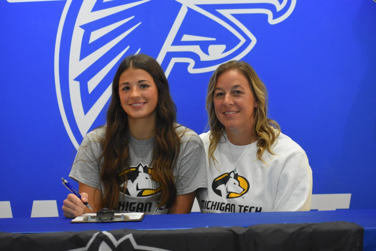 Senior volleyballer Amara Beaudoin signs with the Michigan Tech Huskies, a great moment for both her and her mother, the head coach. 