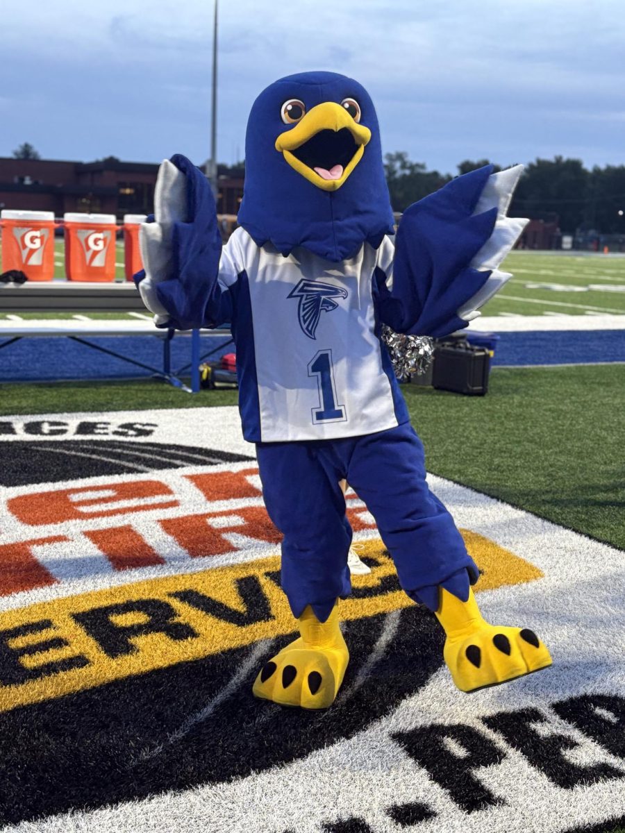 Freddie Falcon hyping up the crowd for another week of football.