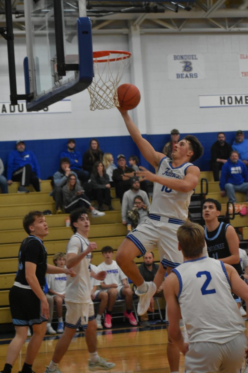 Michael Glodowski drives for two and the win against the Menomonee Eagles. 