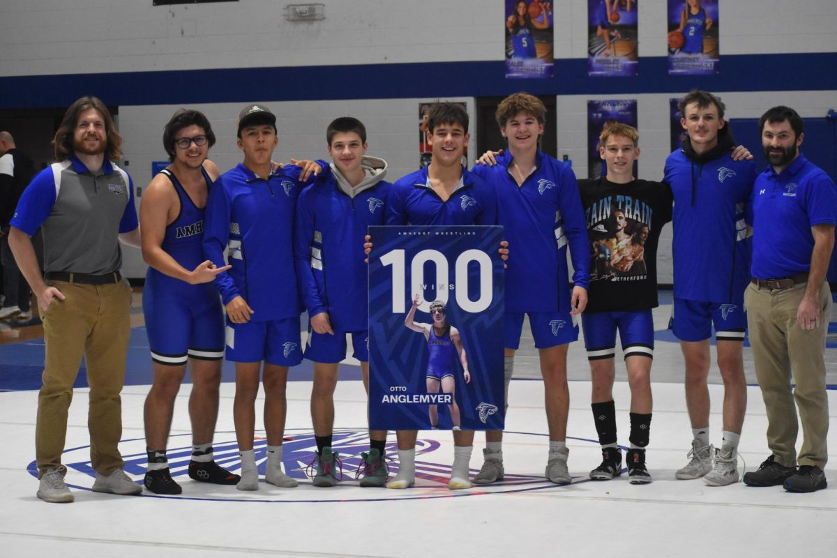 Senior Otto Anglemyer celebrates win #100 with the Amherst Wrestling Team. 
