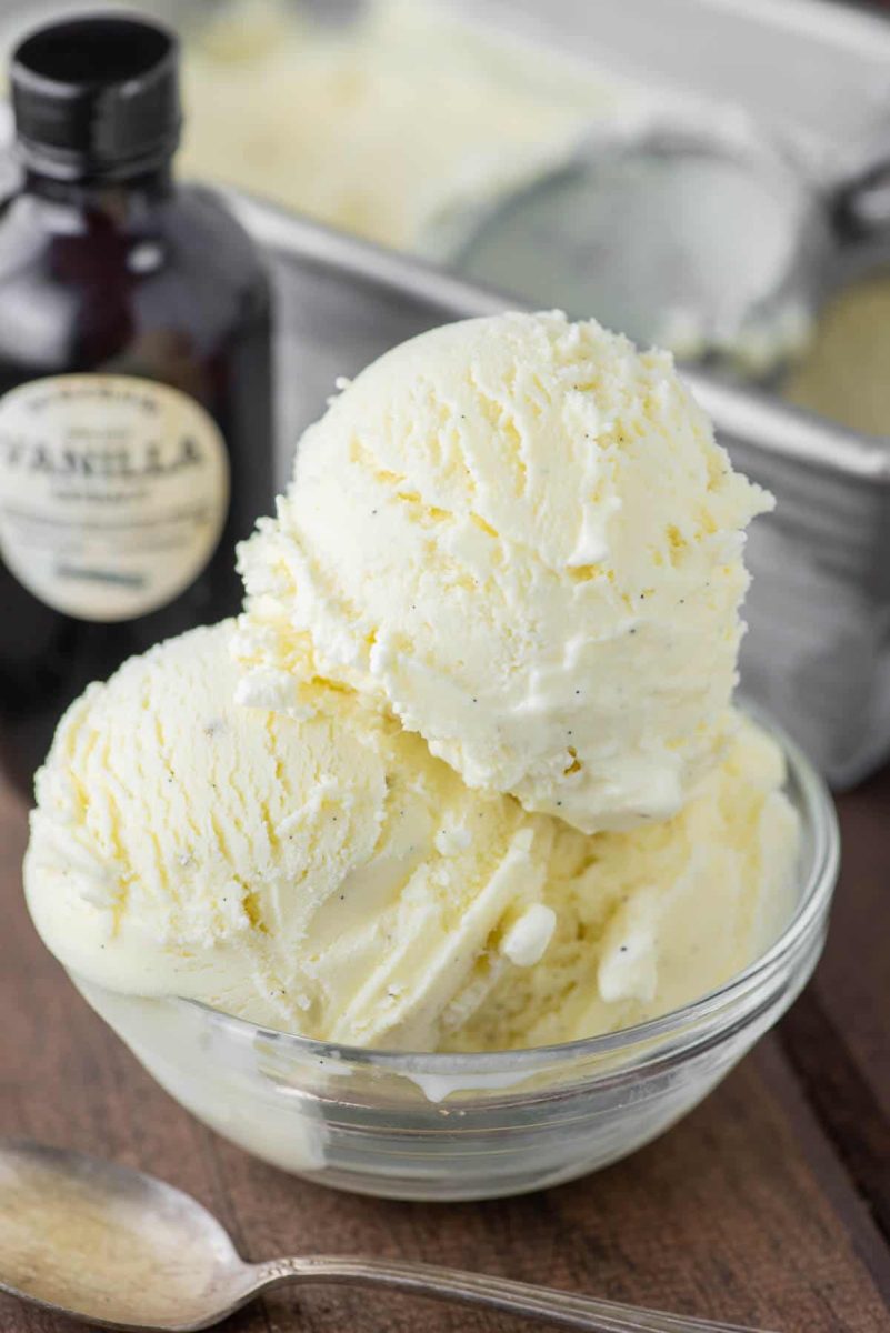 Delicious vanilla ice cream in a clear bowl. Lovely black specks of vanilla bean can be seen.